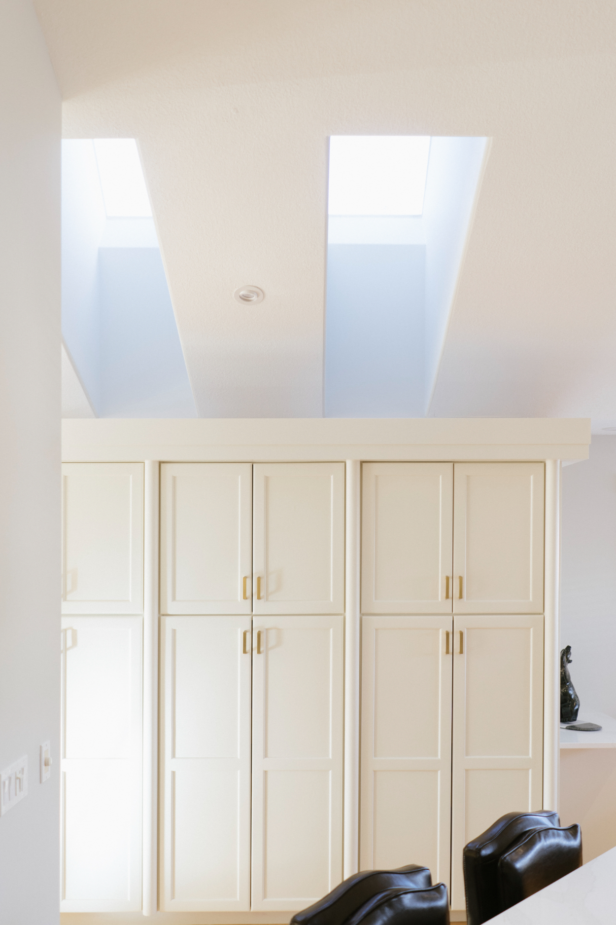 Updated skylights and custom cabinetry in bright kitchen after Varsity Estates home renovation project.